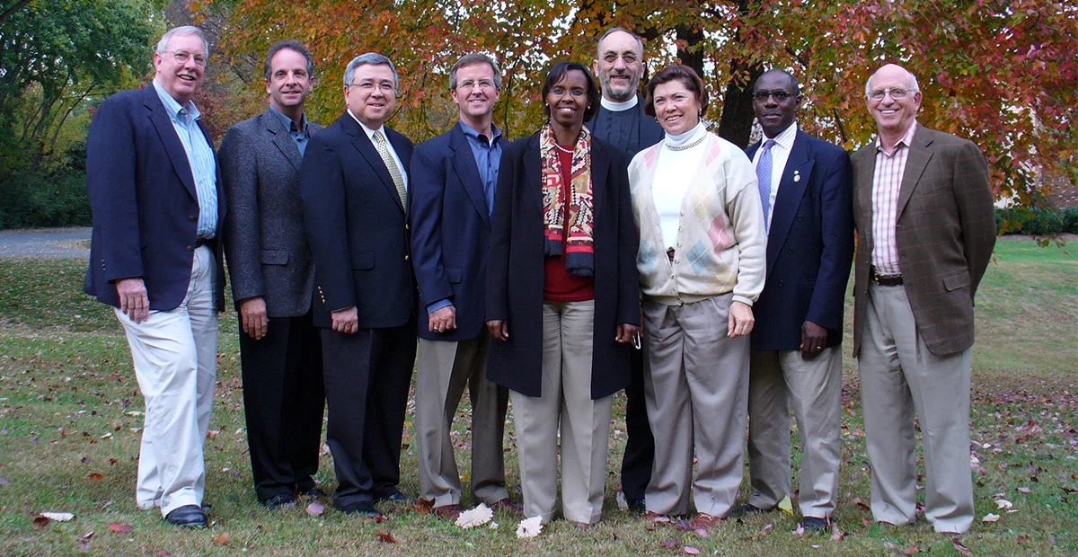 Five Talents International Board of Directors in 2005: Jim Oakes, Joseph Paulini, Keith Chua, Hooks Johnston, Valentine Gitoho, Martyn Minns, April Young, Fred Kalema-Musoke, and Harty Gardner.