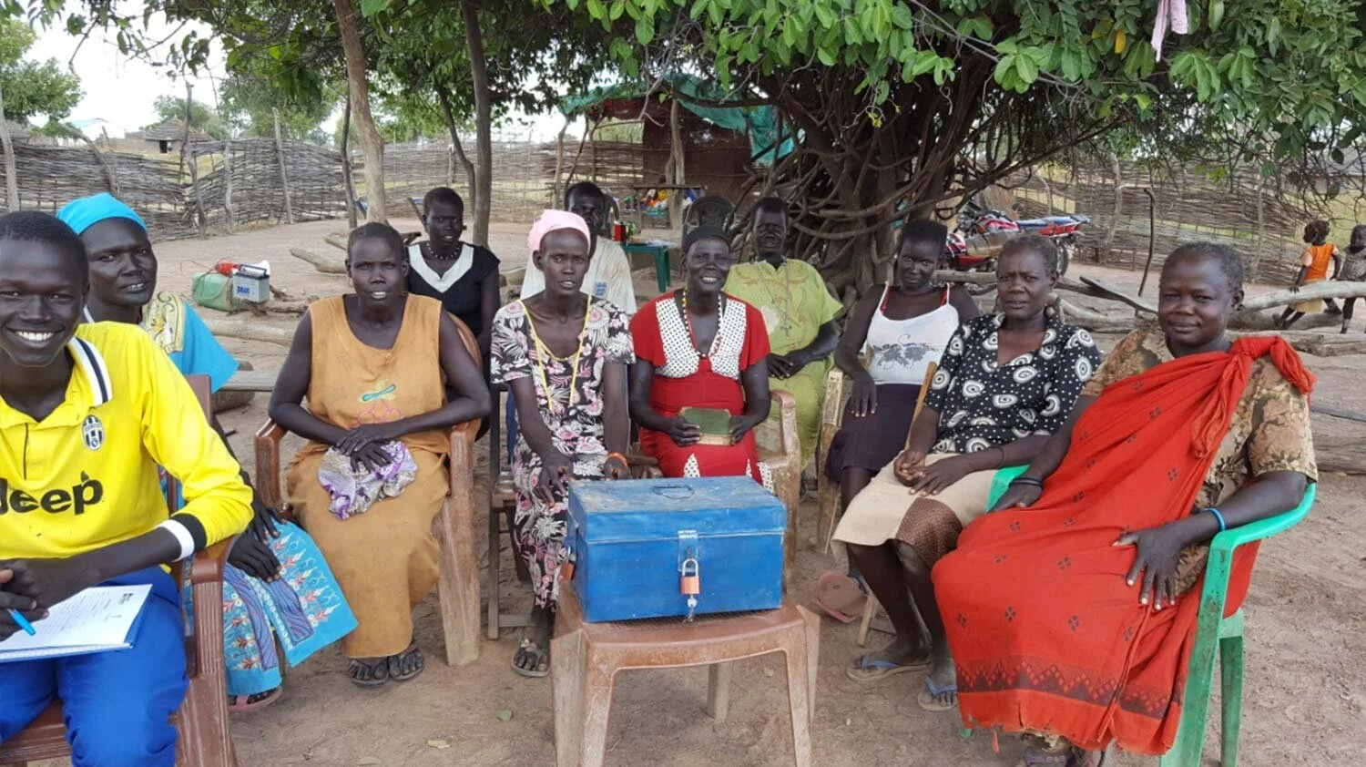 Above: Gondit and Regina with members of their savings group in South Sudan.