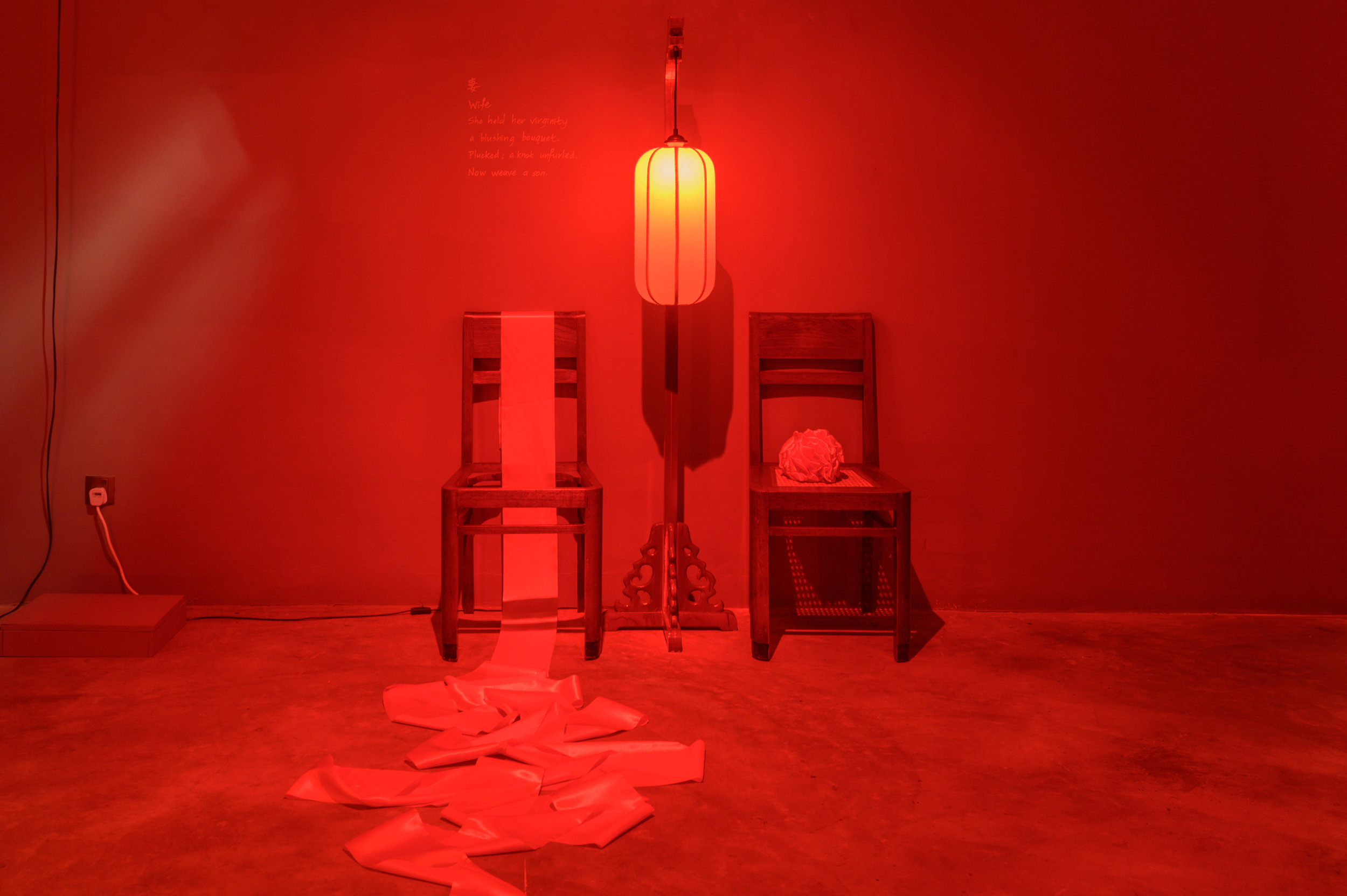   Wife - Stories of a Woman and Her Dowry  2019 Lantern, teak chairs, red ribbons ; Installation 