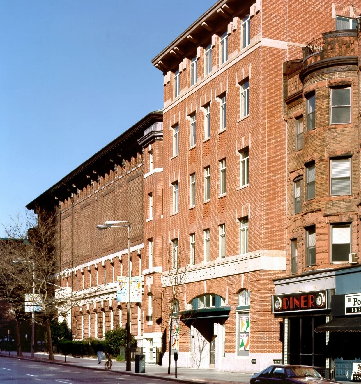 View from Boylston Street of the Genko Uchida Academic Complex in the foreground and the Tennis and Racquet Club Building beyond