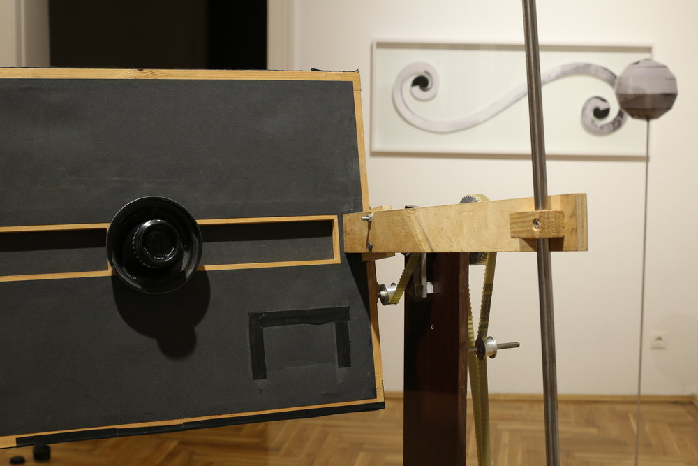 View of the exhibition with the "Orange Space Camera" fabricated by the artist.