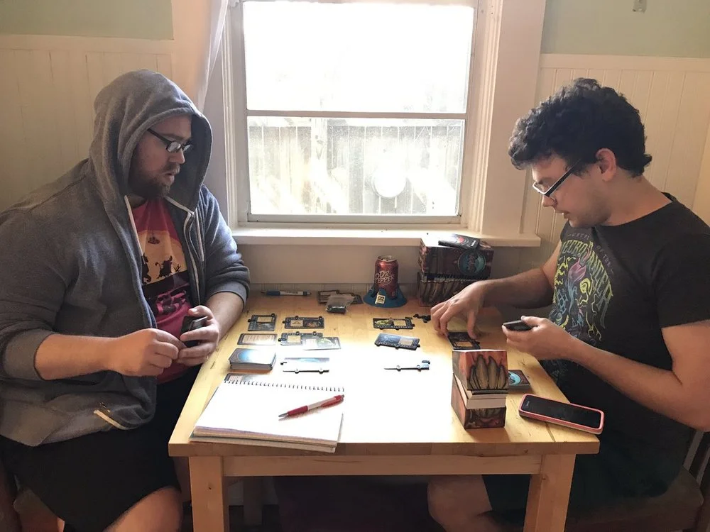 Waitress Games co-founders JR Honeycutt (left) and Brian Neff (right) duel over a game of Gruff at the appropriately-named “Gruff Table”