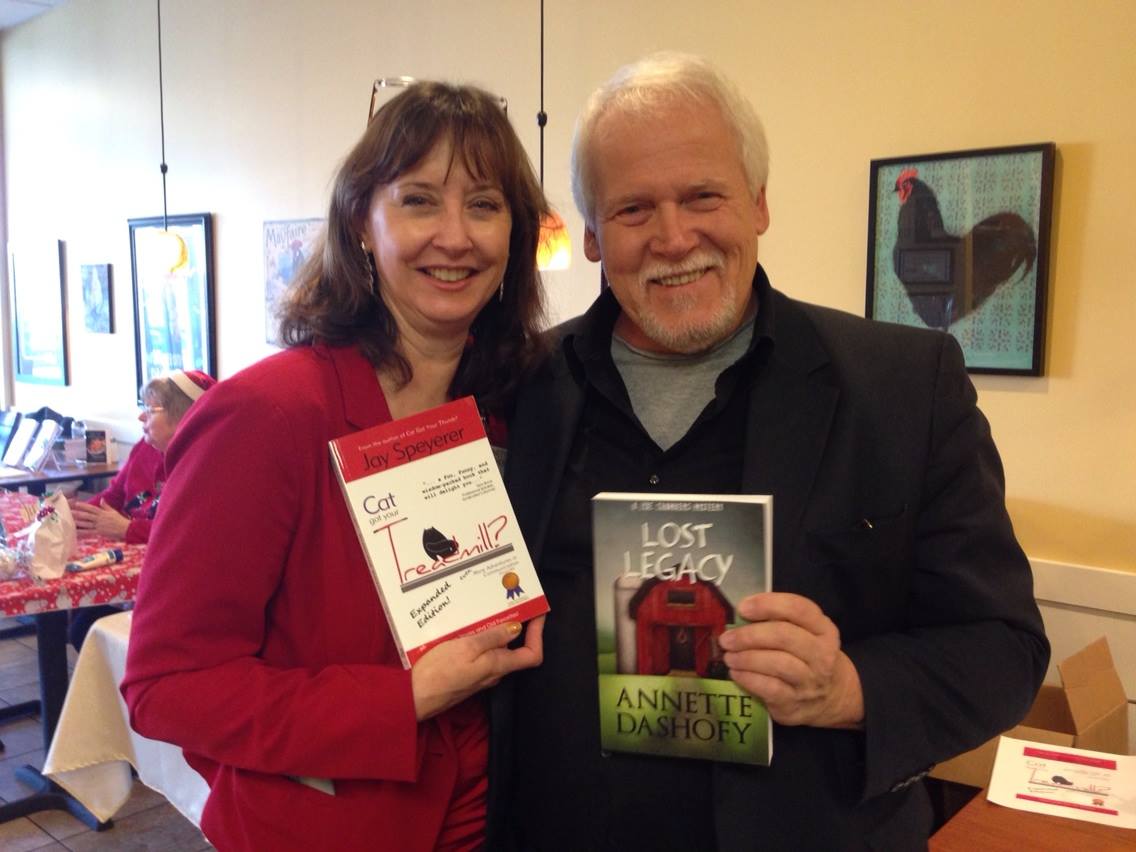 Jay with his friend and fellow author, Annette Dashofy exchanging books and laughs.