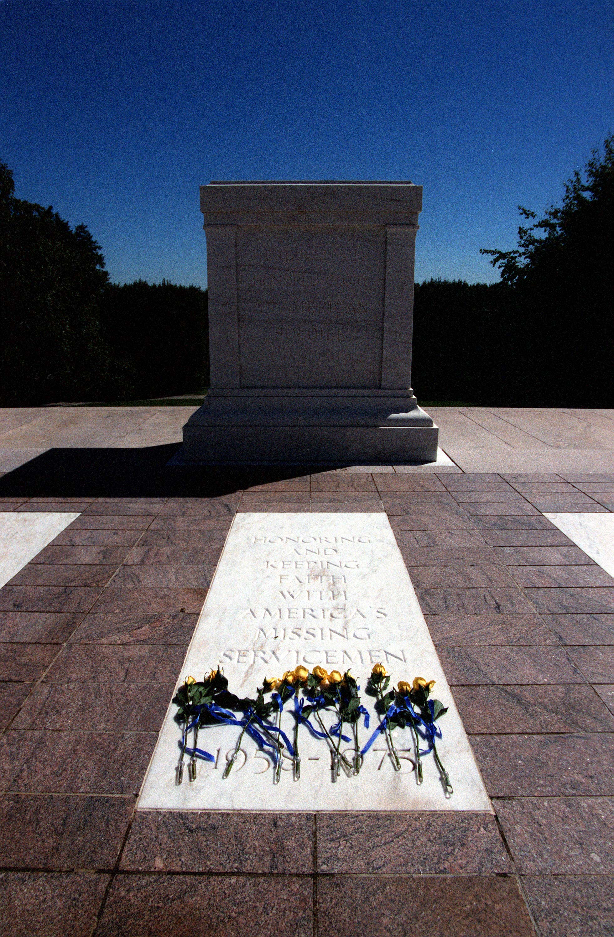  990917-D-2987S-069
	Yellow roses are placed at the base of the empty Vietnam Unknown Crypt where the inscription now reads "Honoring and Keeping Faith with America's Missing Servicemen 1958-1975".  The new inscription on the crypt is being dedicated