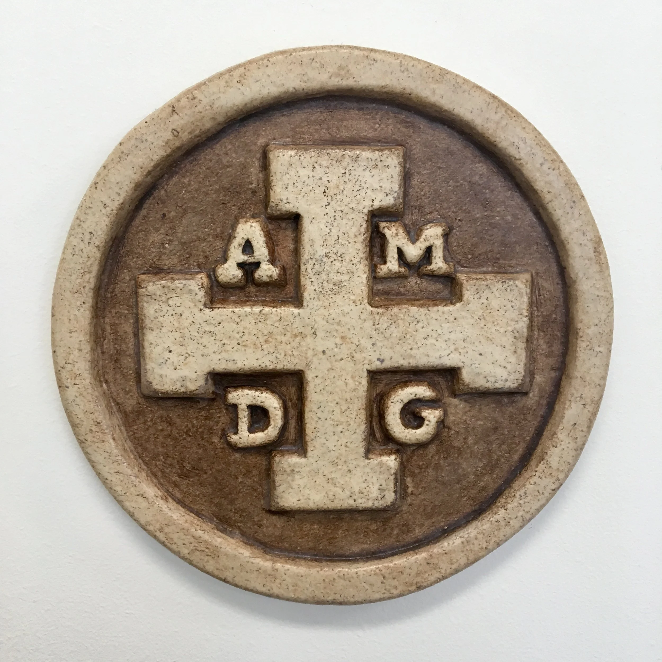 ADMG stands for: Ad Maiorem Dei Gloriam, Latin for "For the Greater Glory of God."
