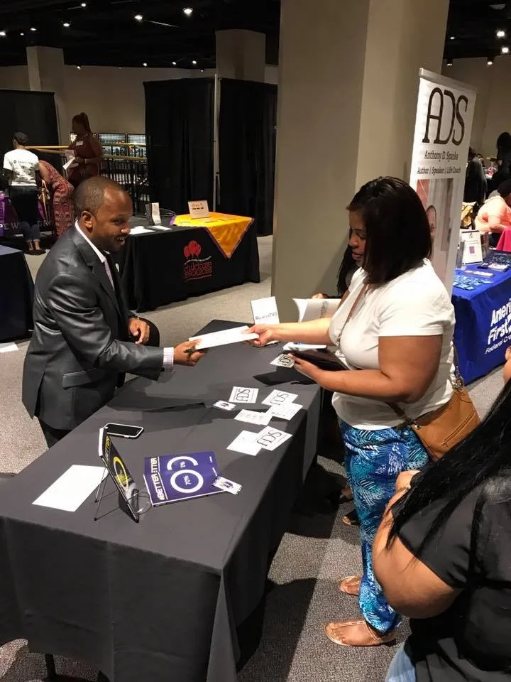 Anthony holding a book signing after speaking at the 2017 Single Mothers' Empowerment Conference