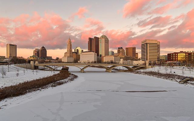 Downtown Columbus over the frozen Scioto river. #columbusohio #frozenriver #sunset #coloursinthesky #sciotoriver