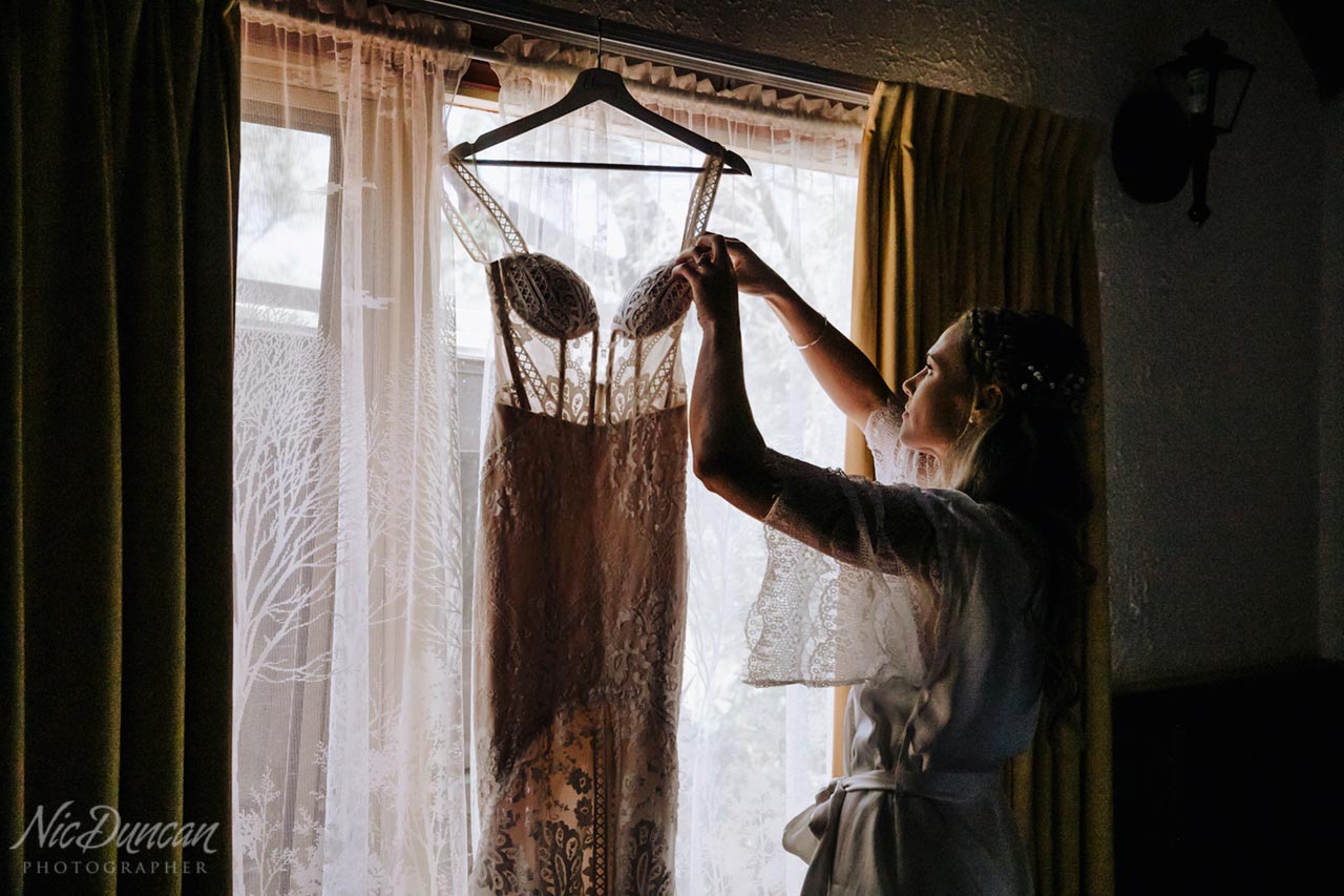 Wedding dress hanging in the window at William Bay Country Cottages, Denmark