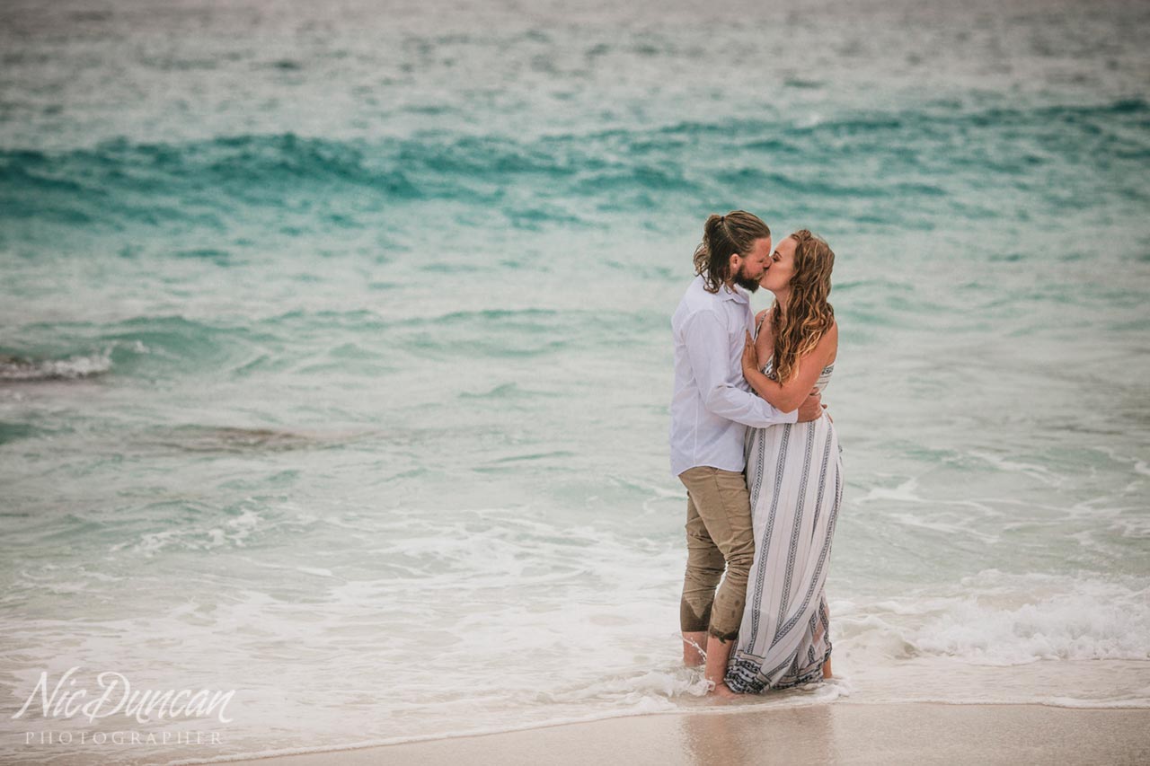 Engagement photo session, playing in the waves