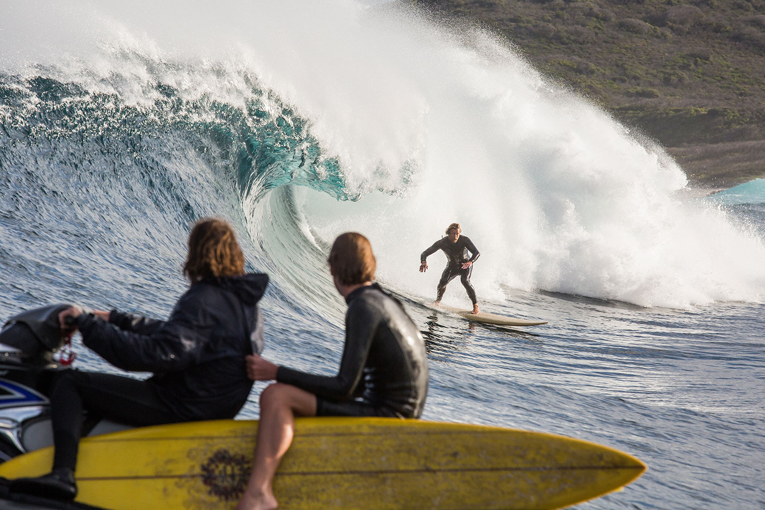 Behind the scenes surf shot Sando (Simon Baker) with Samson Coulter watching on from the jet ski