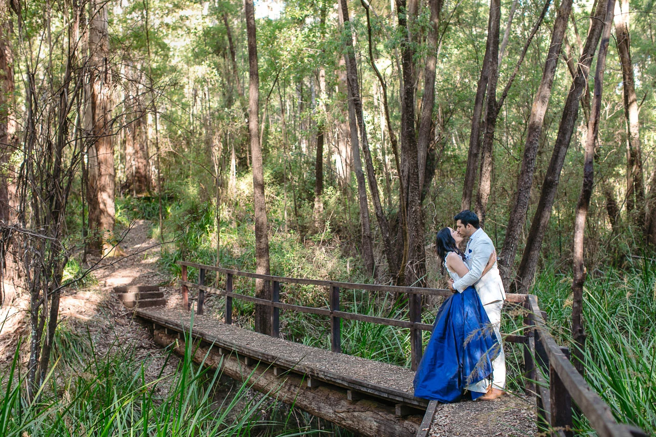Bride and groom on a bridge in the forest, Denmark Western Australia