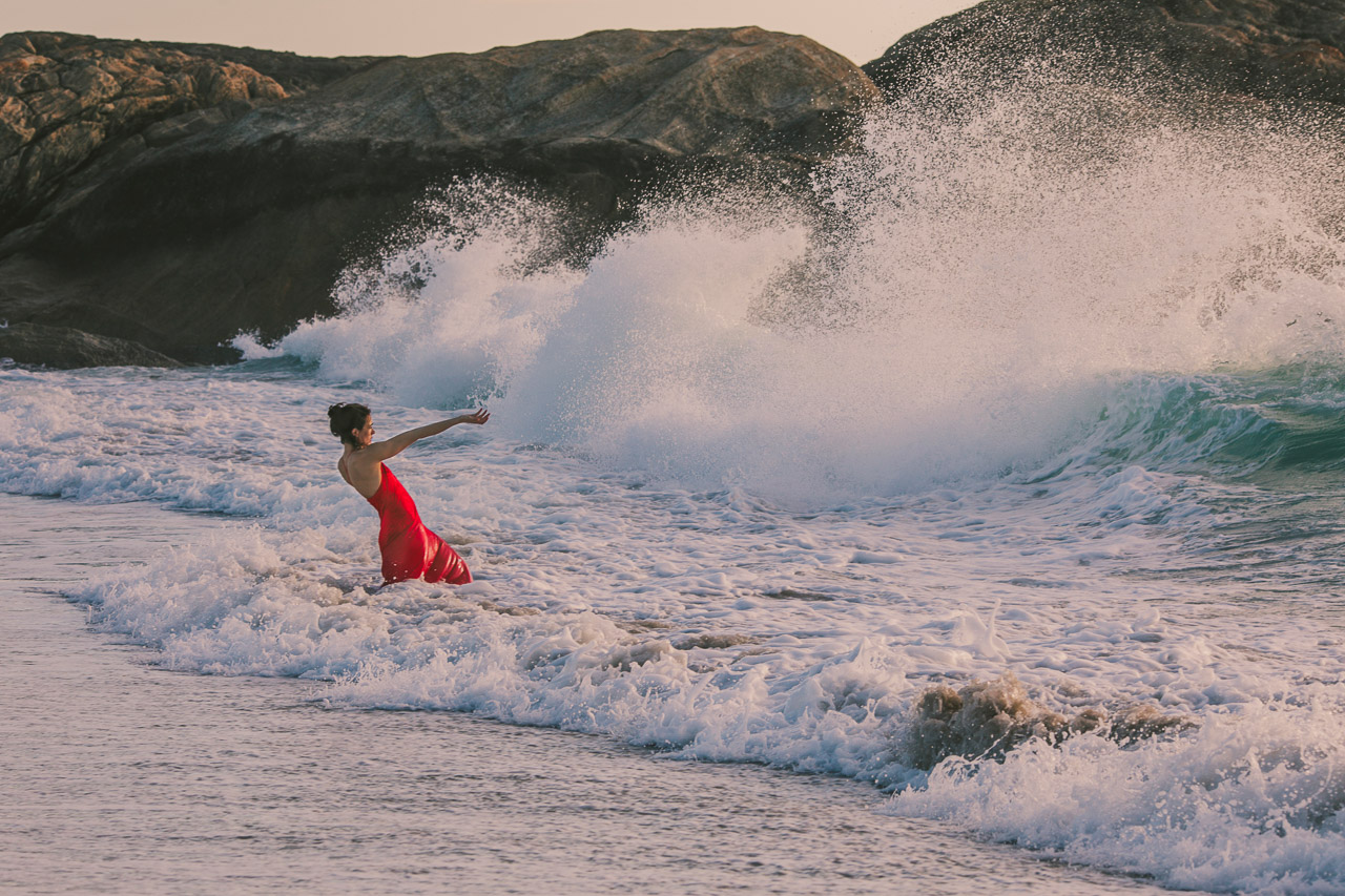 Forces of nature, artist Kate Gillett holding back the ocean. 