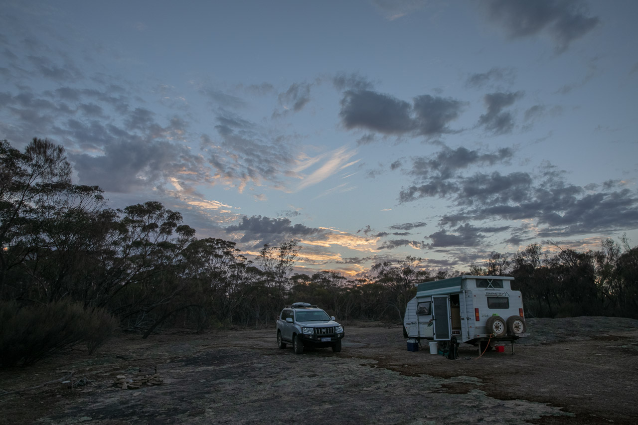 Camping as the sun rises over the granite outcrop in Lake Grace, Western Australia