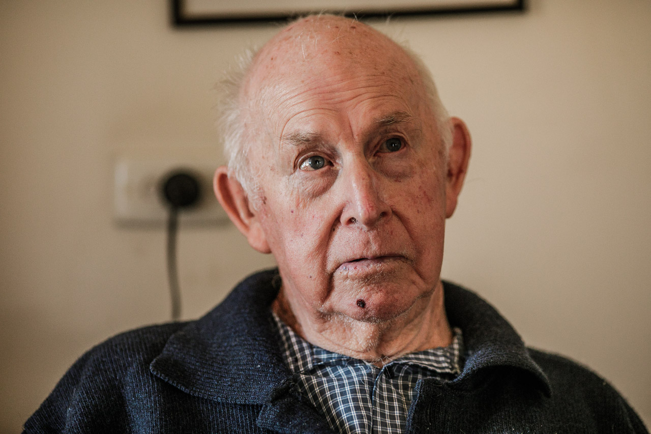 Elderly man with bald head and shaving cut