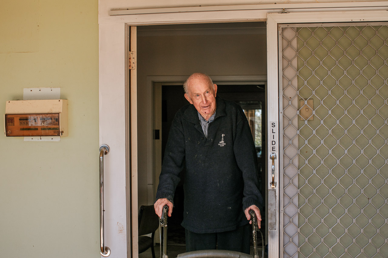 Old man greeting or saying goodbye to visitors