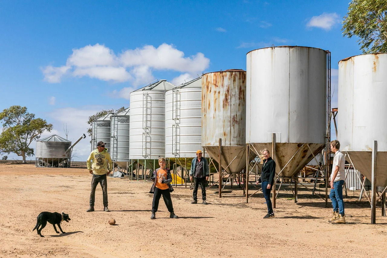 Family photo session on the farm with silos