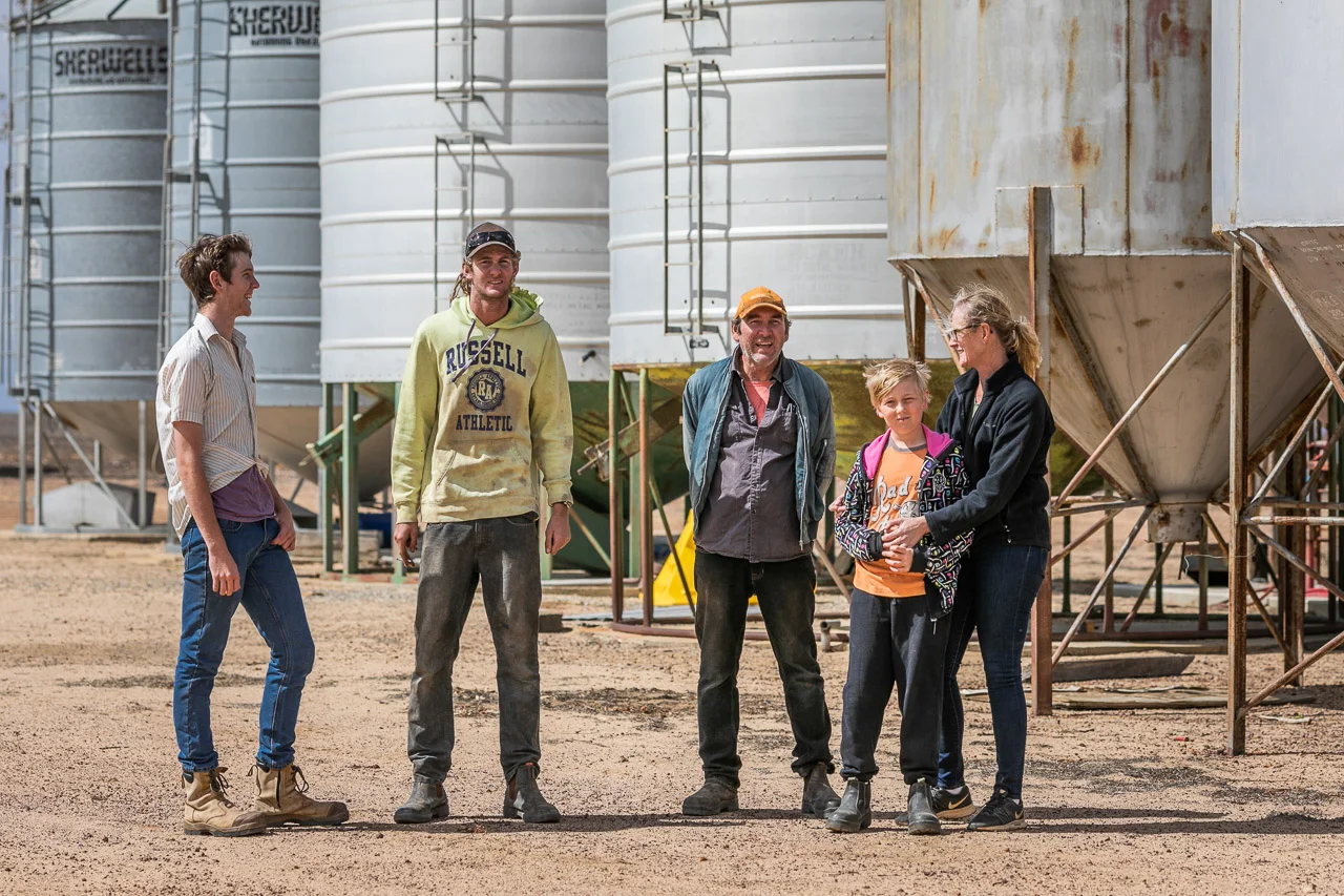 Portrait session by the silos on the family farm