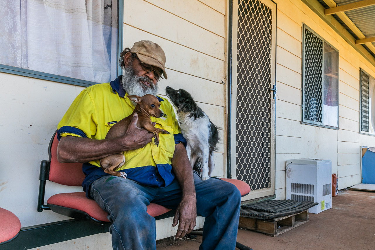 Aboriginal man, Patrick Simpson, with his two dogs in Yalgoo