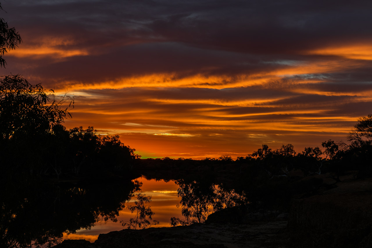 The sunrise reflecting perfectly in the Murchison River at Wooleen