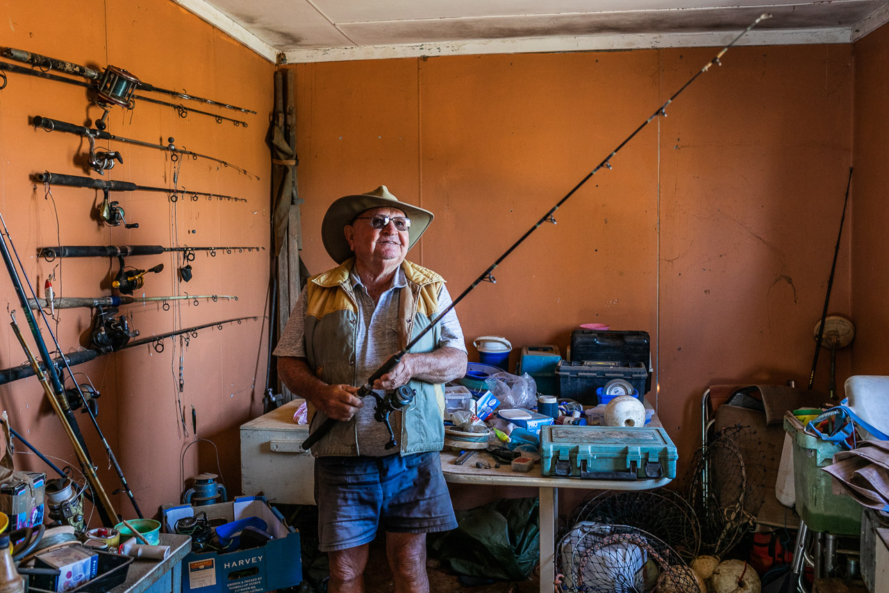 Aussie bloke with his fishing rod collection