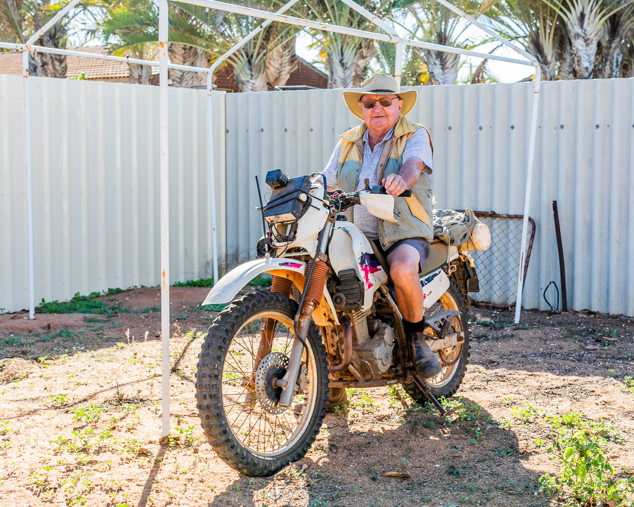 Old roo shooter on a motorbike