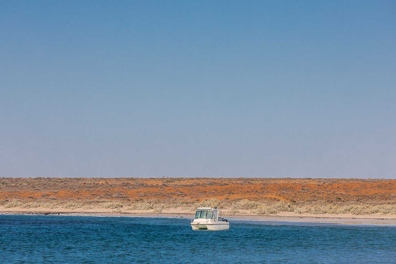 A boat in the calm waters of Gnaraloo Bay