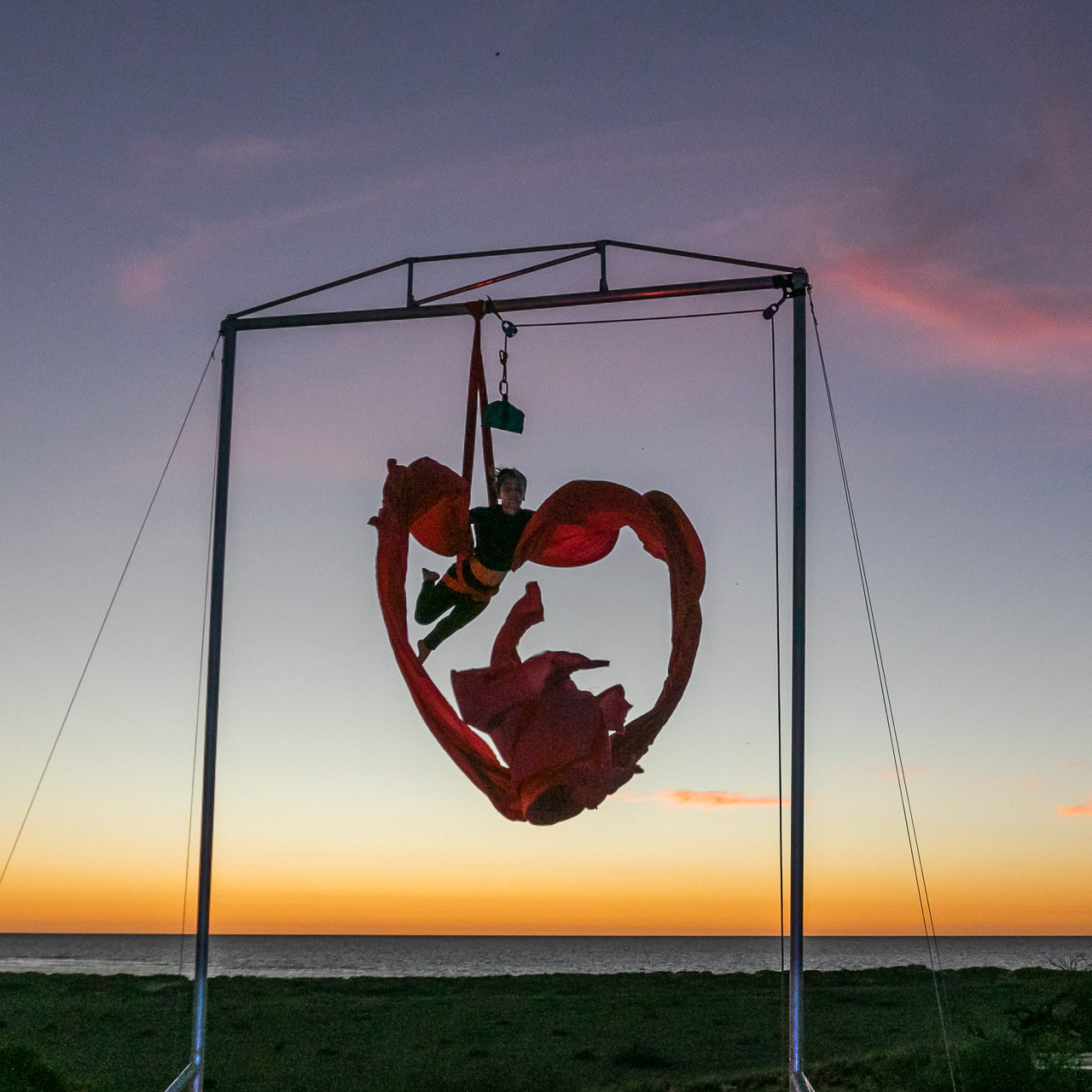 Aerial artist Theaker von Ziarno rehearsing at sunset