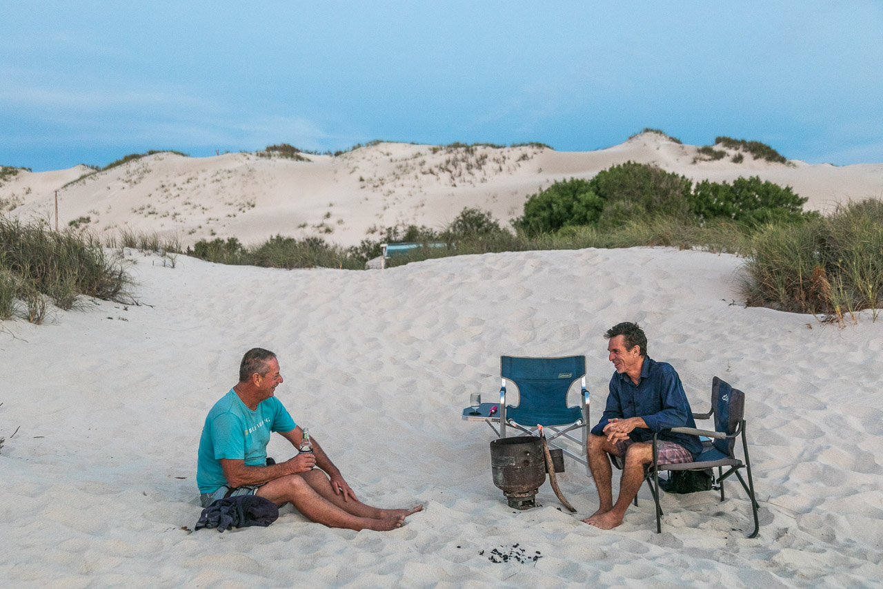 A beer and a chat around the camp fire
