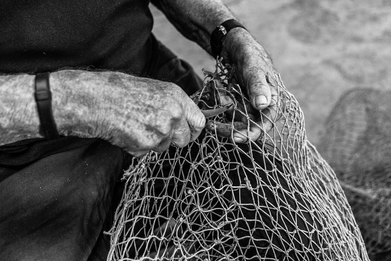 Mending holes in prawn nets at Exmouth Prawns 