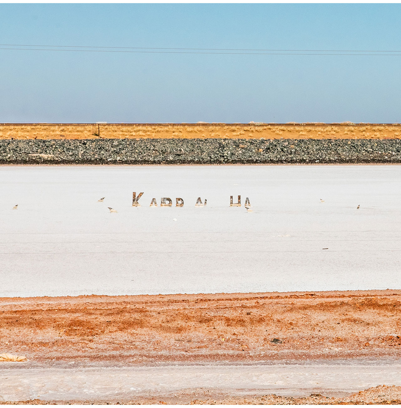 Horizontal lines of the railway track and salt flats near Karratha in the Pilbara region of Western Australia