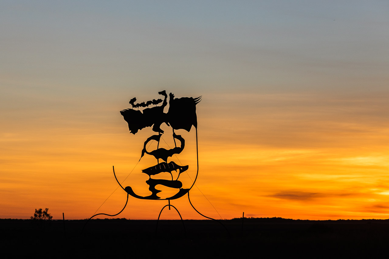 Mark Norval's six metre high sculpture on the marsh in Derby at sunset