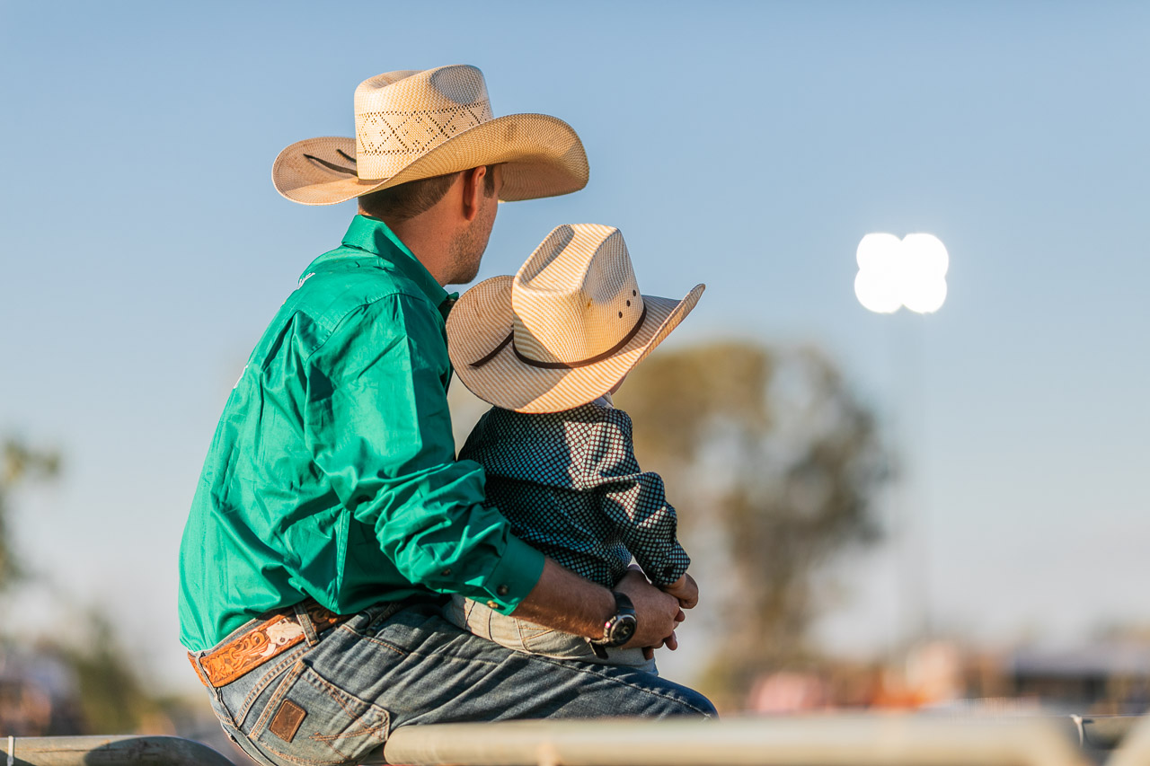 Father and baby son watching the rodeo - Broome Rodeo 2019