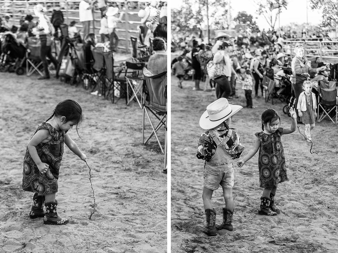 Young girls wearing cowboy boots drawing in the dirt with a stick at the Broome Rodeo