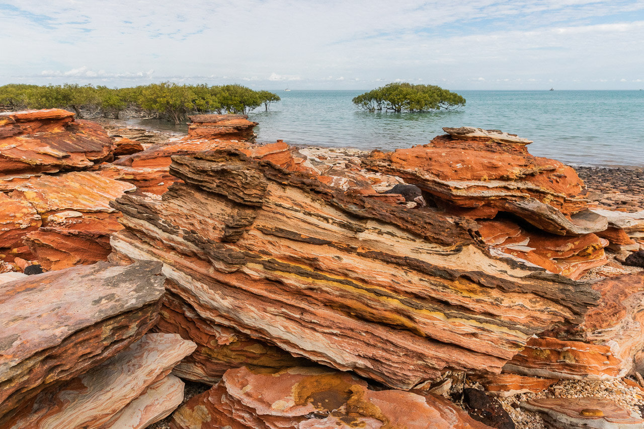 Rock patterns and mangroves at Broome's Town Beach