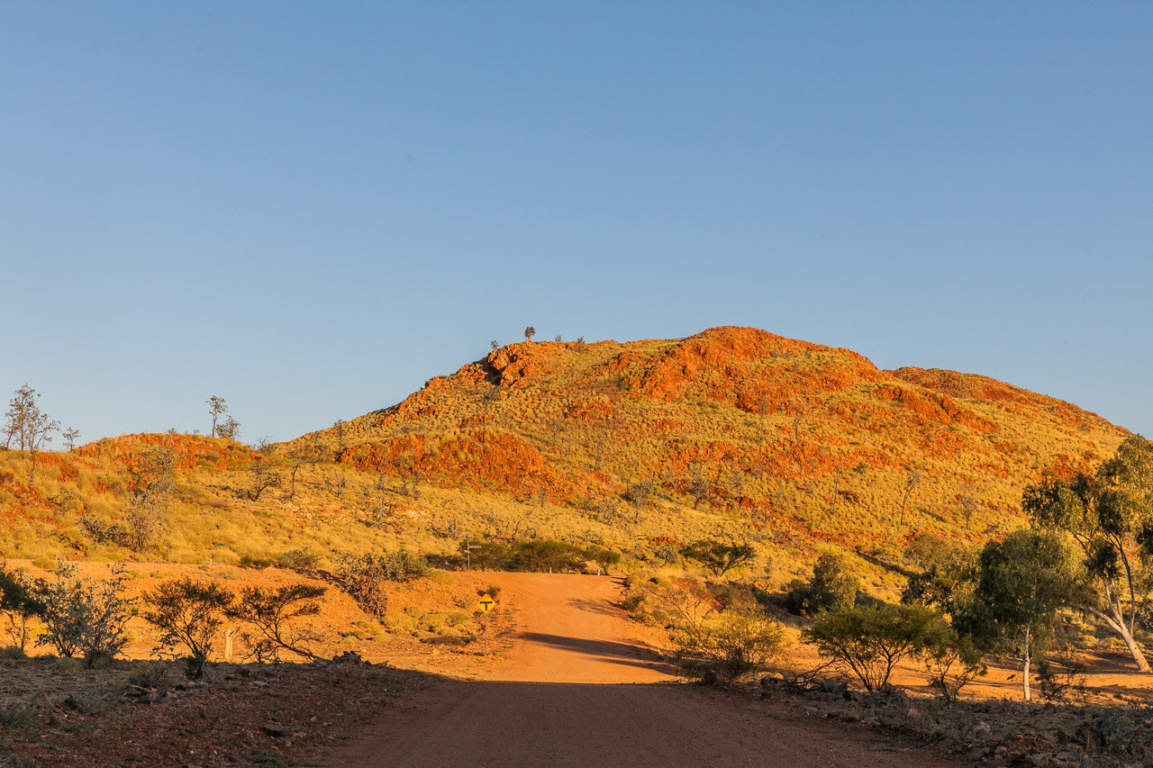 The landscape around Marble Bar glows in the late afternoon light