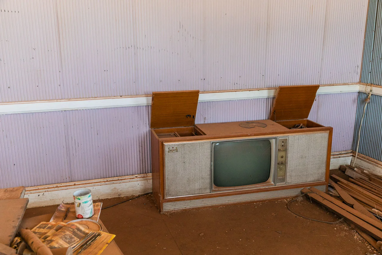 An old TV and record player in the corner at the now deserted masonic lodge in Cue, Western Australia