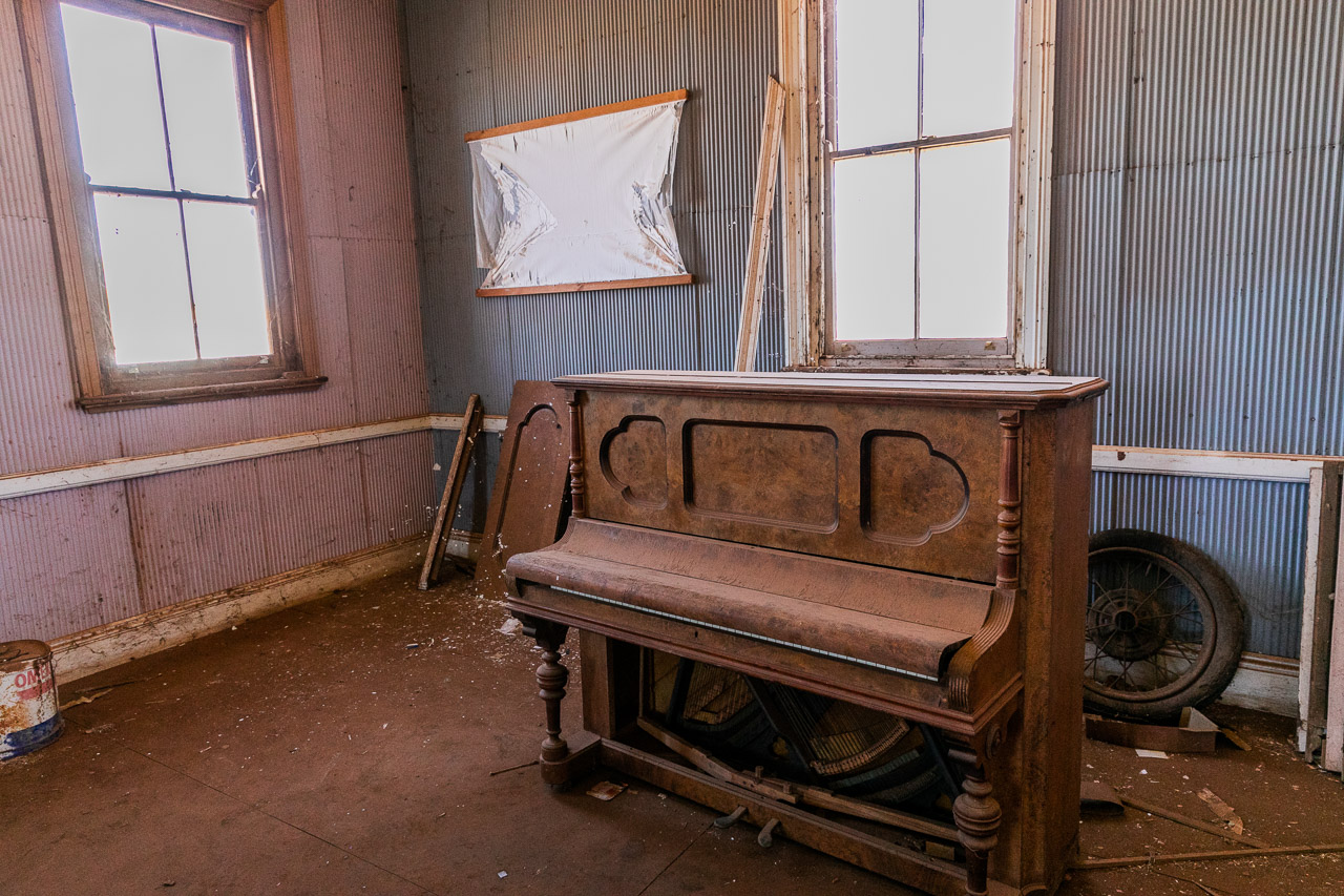 A piano gathering dust in Cue's Masonic Lodge spooky house