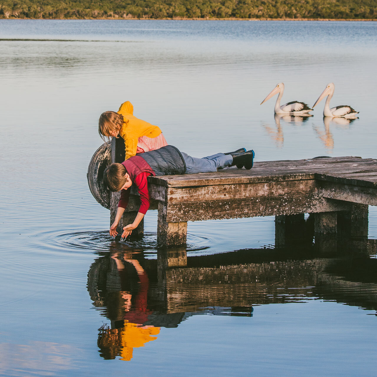 Two children and their reflections in a family portrait session in Denmark, WA