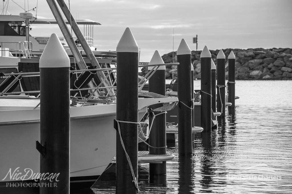Augusta marina with boats tied up to their dock