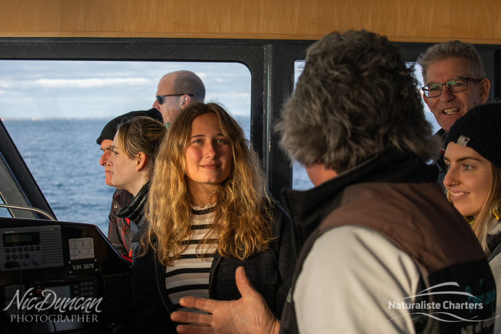 Skipper Dundee answers the passengers questions about the whales