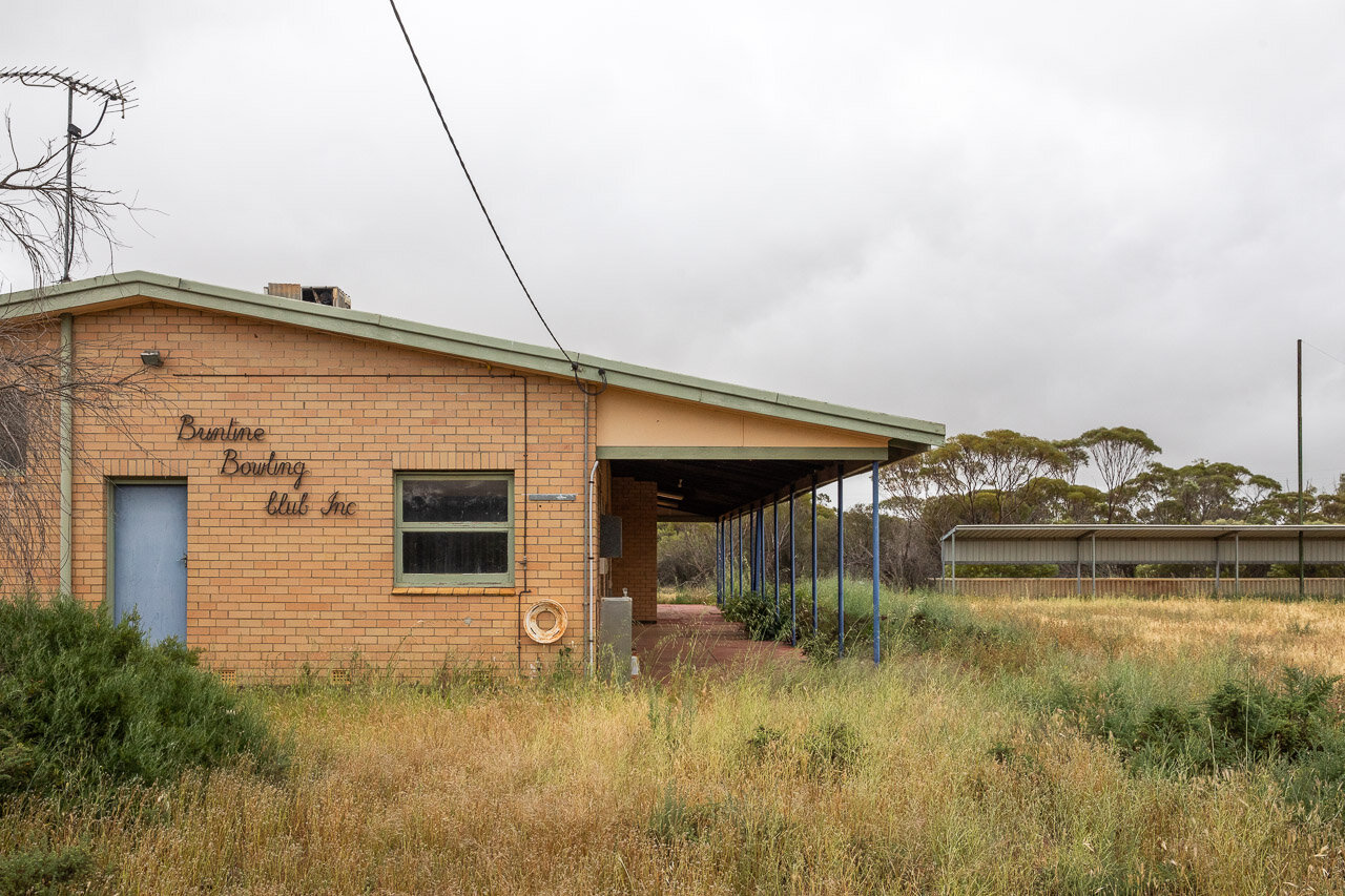 The Buntine Bowling Club has seen better days, with long grass covering the bowling green.