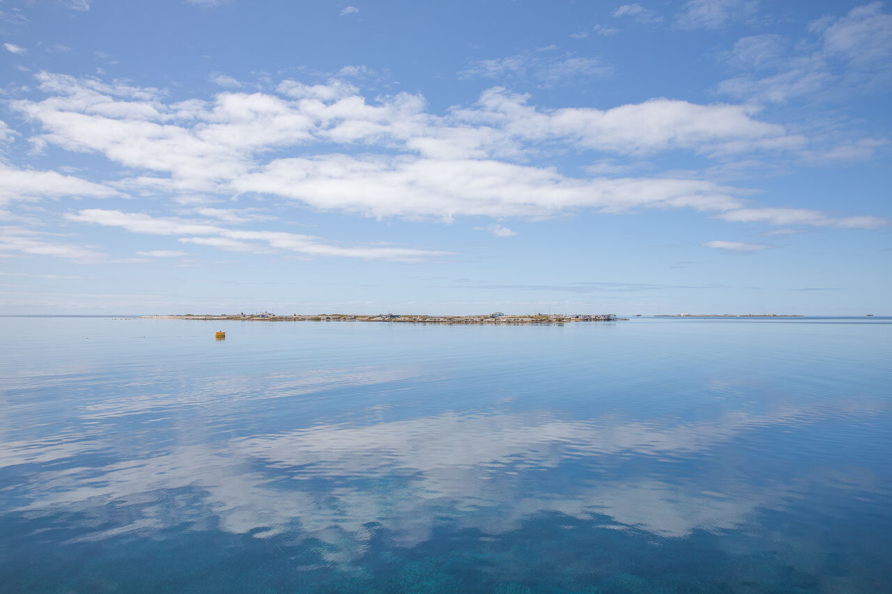 A glass-off and Post Office Island - one of a series of low lying coral islands of the Abrolhos, off Western Australia, 