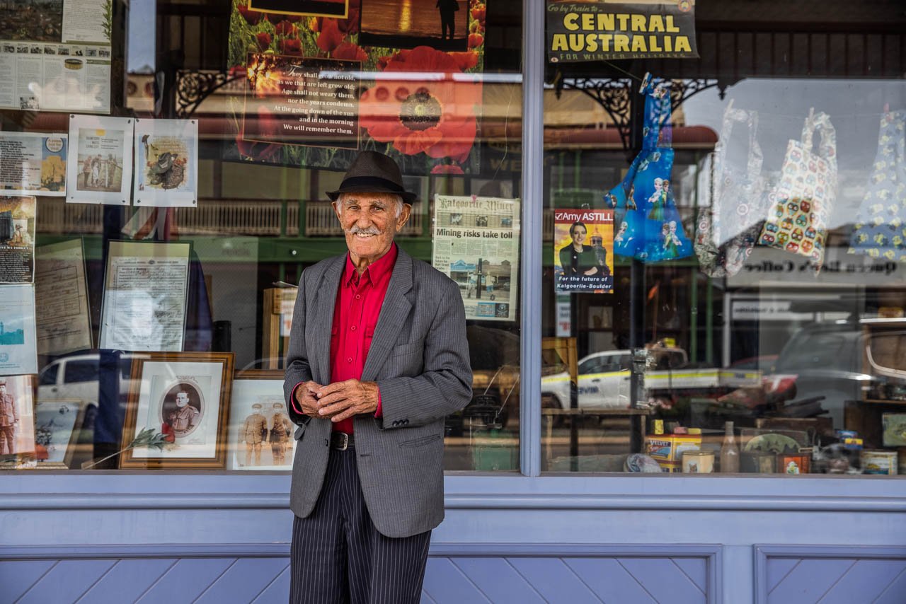 Stylish old man outside a second-hand shop