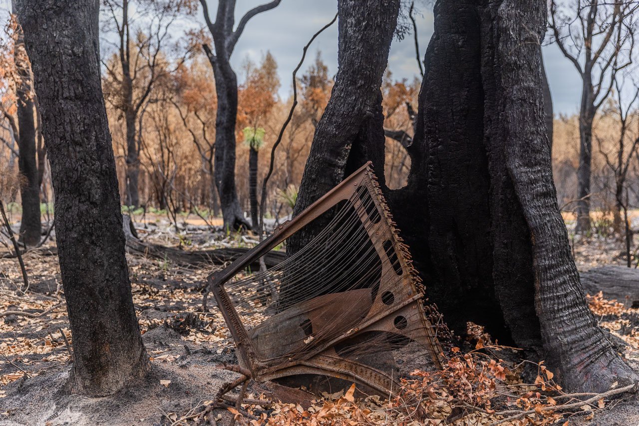 What was once an old piano in the bush is now a burnt sculpture