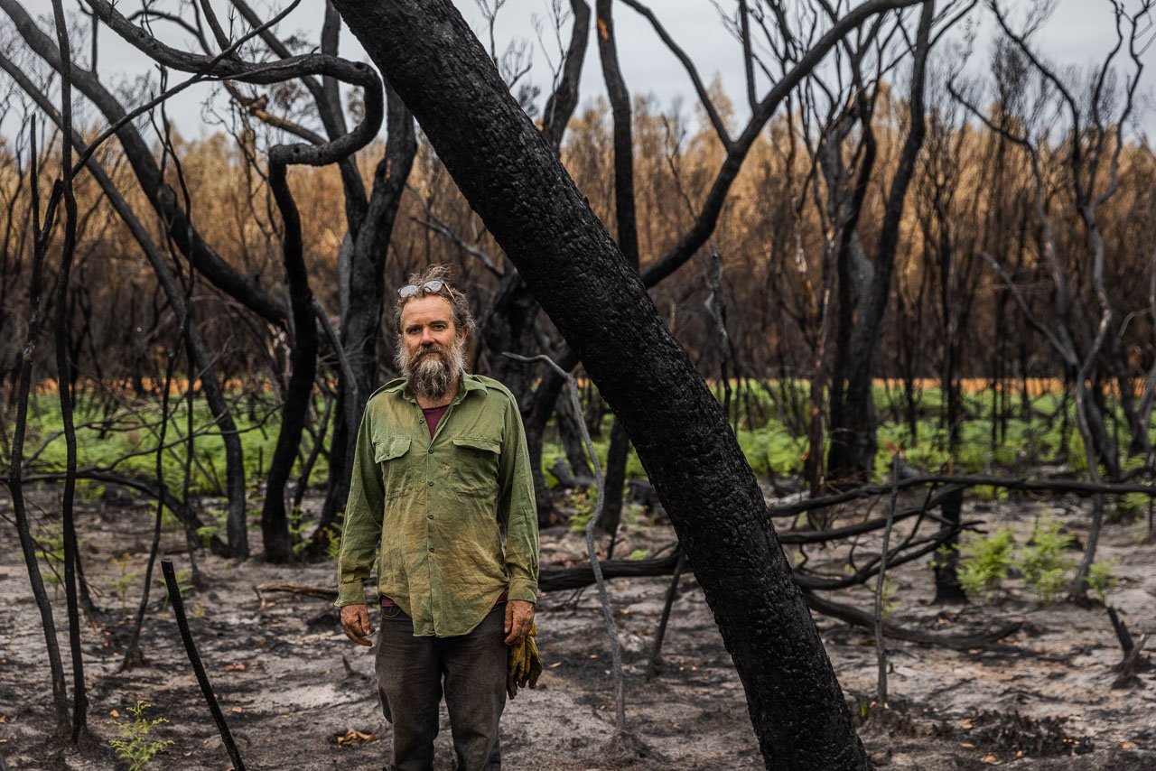 James Gentle - man amid the burnt remains of his bush block in Denmark