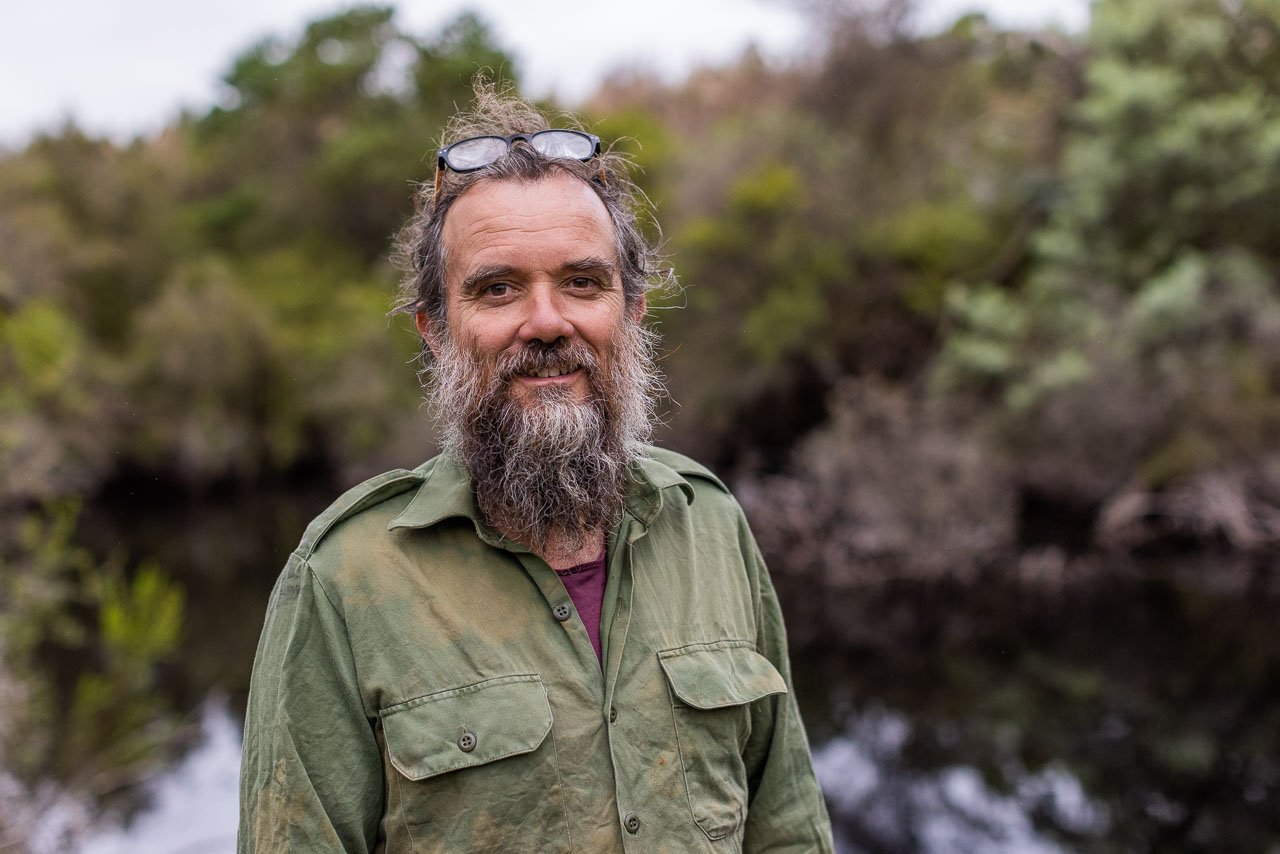 Bearded man by a dam in the Australian bush