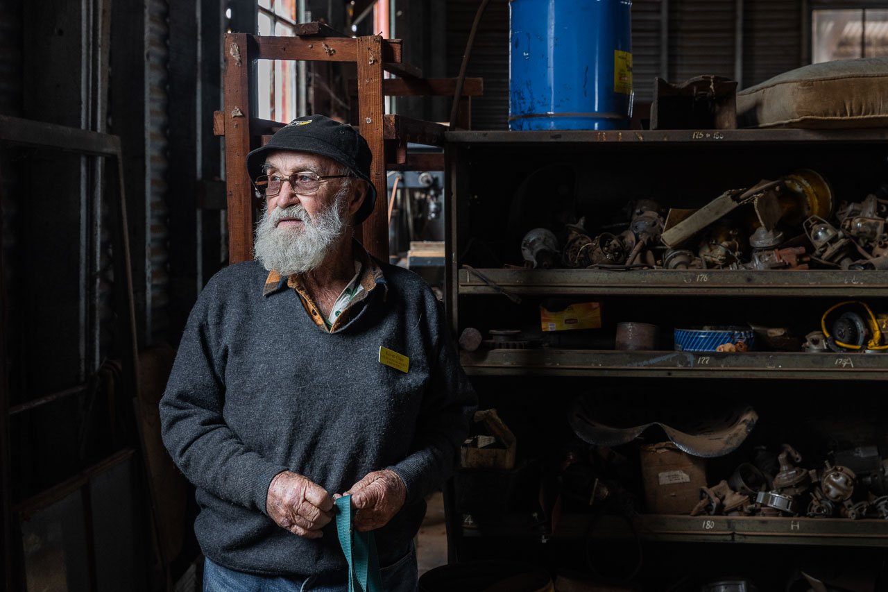 Man in his shed surrounded by old tools and treasure