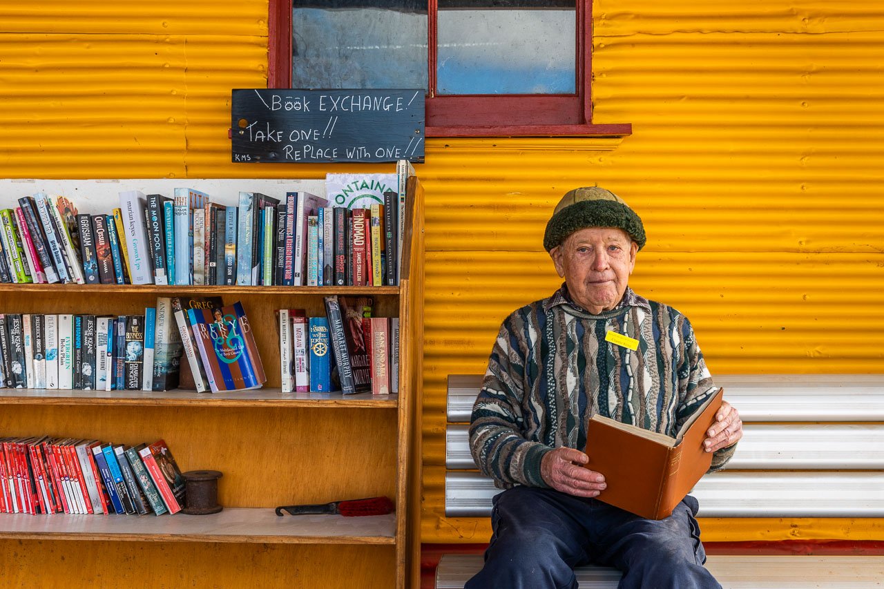 Clarrie King photographed beside the book exchange he set up outside the Kulin Museum and Men's Shed