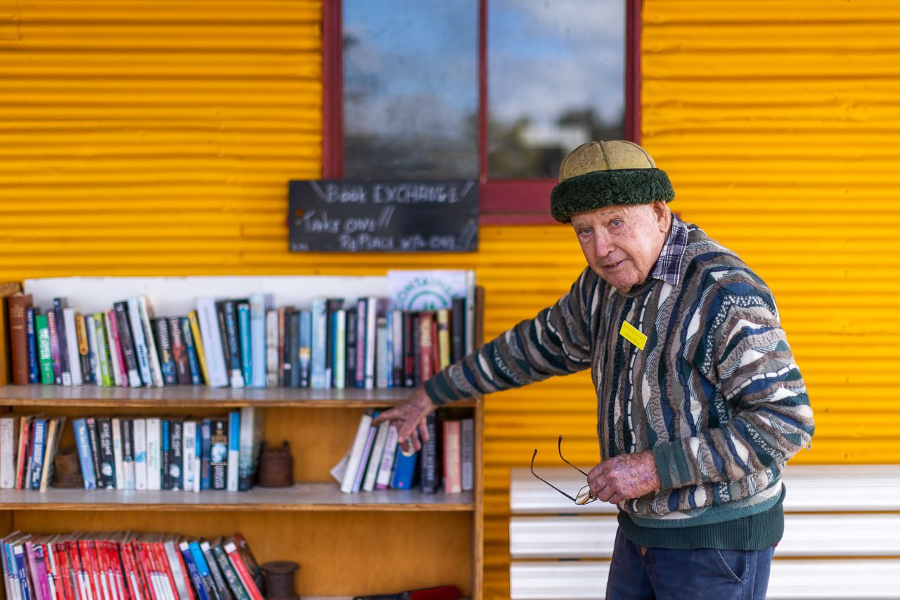 Old man with a collection of secondhand books