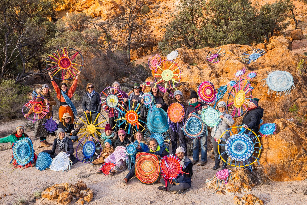 The participants with the rugs on the 2021 Reclaim the Void camp in the Northern Goldfields of Western Australia